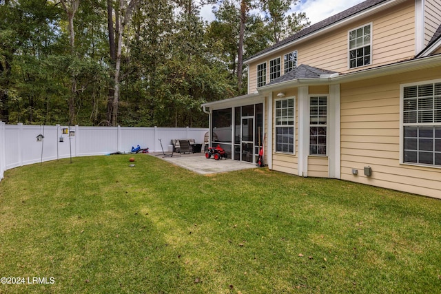 view of yard with a patio area and a sunroom