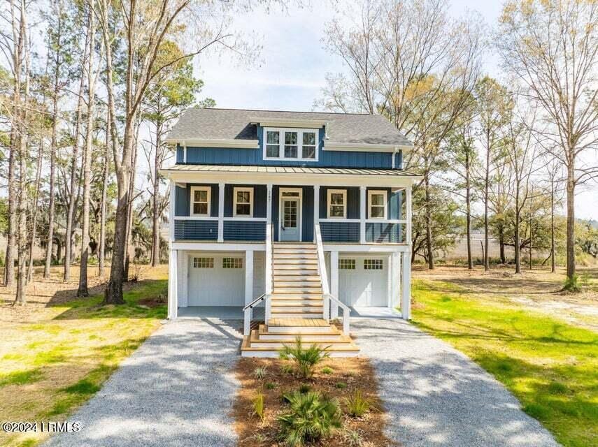 view of front of home with a garage and covered porch