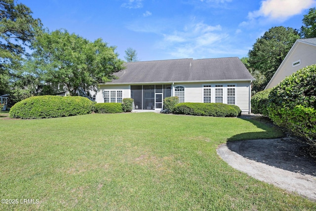 122 Island W Dr, Bluffton, SC 29910 - rear view of property featuring a lawn and a sunroom