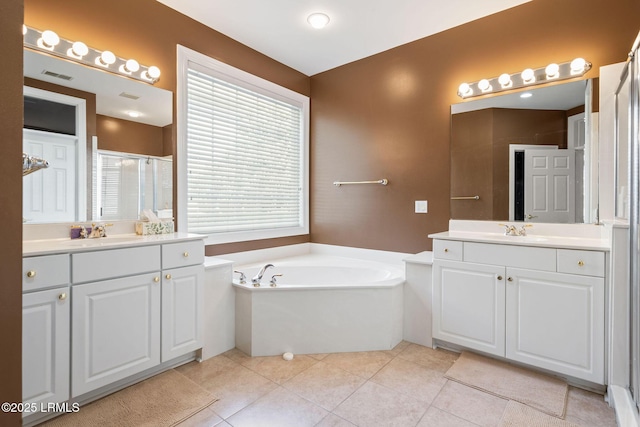 122 Island W Dr, Bluffton, SC 29910 - full bathroom with tile patterned floors, two vanities, a sink, a stall shower, and visible vents