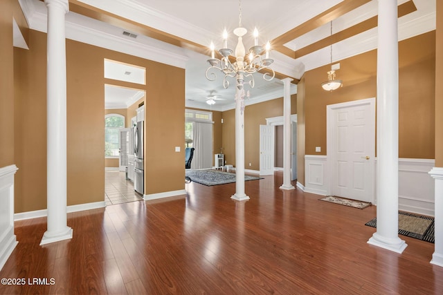 122 Island W Dr, Bluffton, SC 29910 - interior space with ceiling fan with notable chandelier, wood finished floors, visible vents, and crown molding
