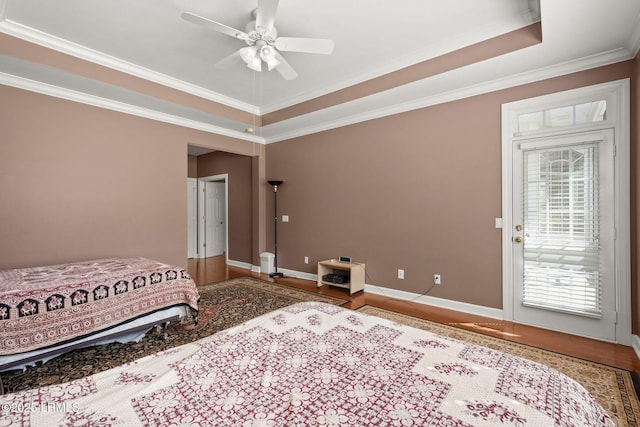 122 Island W Dr, Bluffton, SC 29910 - bedroom with baseboards, wood finished floors, access to outside, and ornamental molding