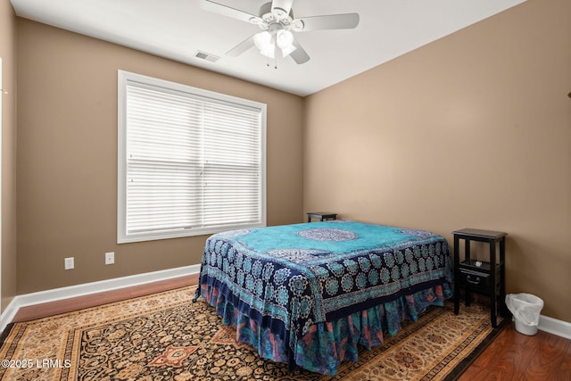 122 Island W Dr, Bluffton, SC 29910 - bedroom featuring ceiling fan, baseboards, wood finished floors, and visible vents
