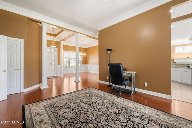 122 Island W Dr, Bluffton, SC 29910 - office space featuring baseboards, a chandelier, ornate columns, wood finished floors, and crown molding