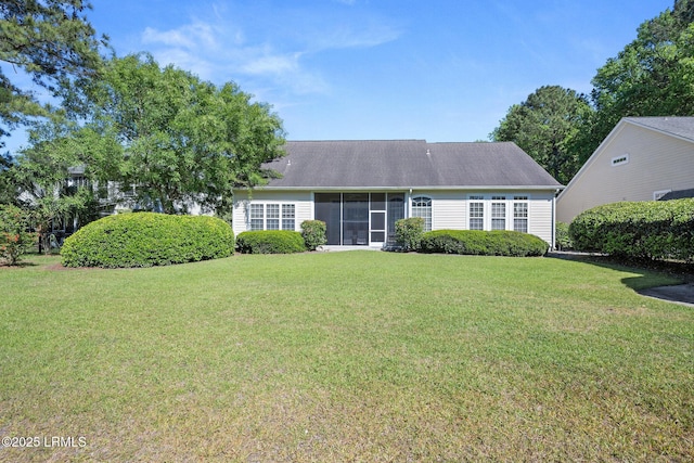 122 Island W Dr, Bluffton, SC 29910 - view of front of house with a sunroom and a front yard