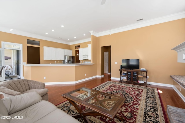 122 Island W Dr, Bluffton, SC 29910 - living room featuring dark wood finished floors, baseboards, recessed lighting, ceiling fan, and crown molding