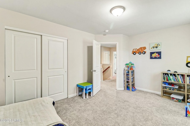 bedroom featuring carpet floors, a closet, and baseboards