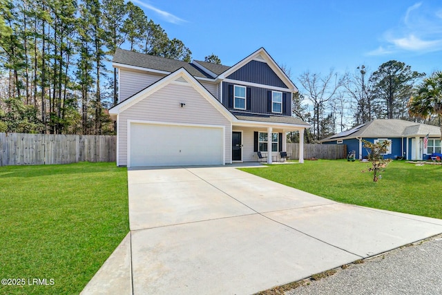 traditional home featuring a front lawn, board and batten siding, and fence