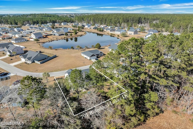 aerial view featuring a water view and a residential view