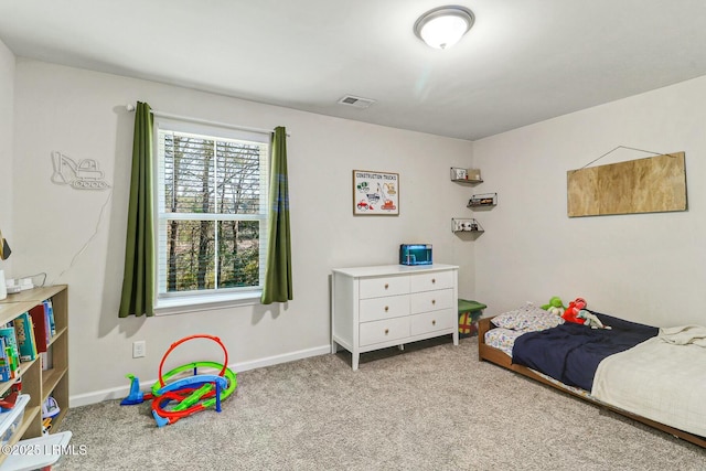 bedroom with light carpet, visible vents, and baseboards