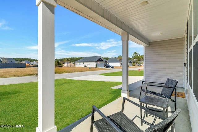 view of patio / terrace with a porch and a residential view