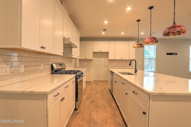 54 Slash Pine Dr, Okatie, SC 29909 - kitchen featuring white cabinets, a sink, stainless steel appliances, recessed lighting, and decorative backsplash