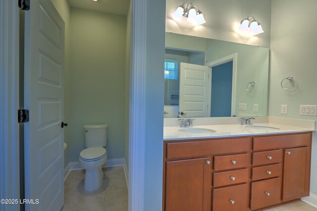 54 Slash Pine Dr, Okatie, SC 29909 - bathroom featuring double vanity, a sink, tile patterned floors, and toilet