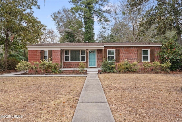 ranch-style home with a front yard