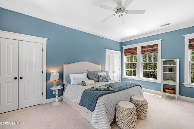 bathroom featuring double vanity, baseboards, and crown molding