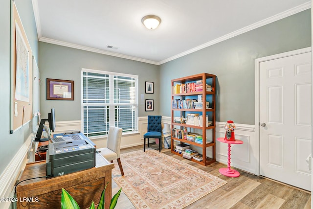 office with ornamental molding and light wood-type flooring