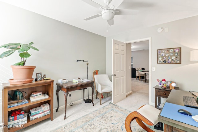 home office featuring ceiling fan and light colored carpet