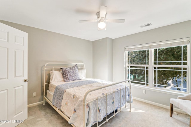 carpeted bedroom with ceiling fan