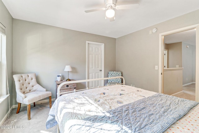 bedroom with light colored carpet and ceiling fan