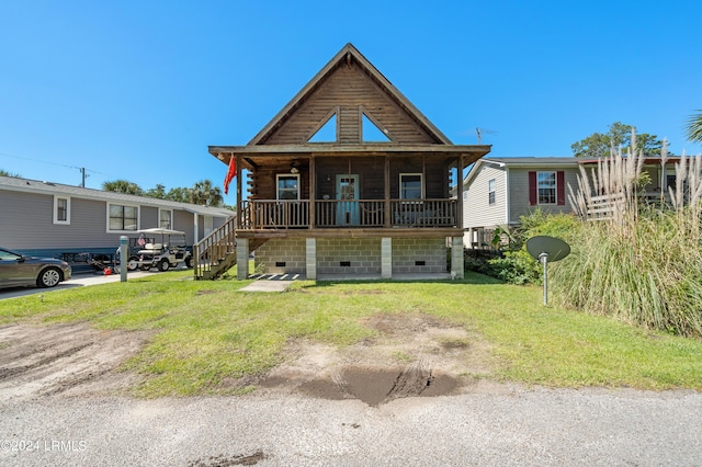 log home featuring a front yard and covered porch