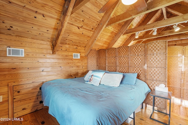 bedroom with wood ceiling, rail lighting, wood walls, lofted ceiling with beams, and light wood-type flooring