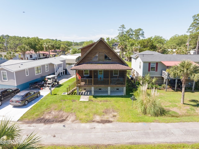 view of front of home featuring a front yard and covered porch