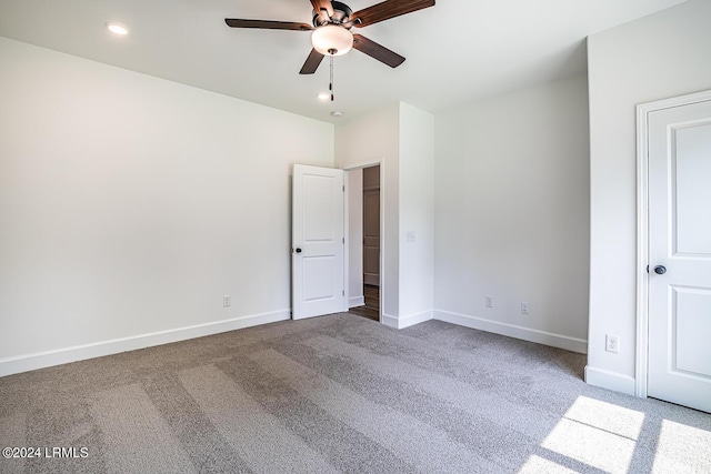 unfurnished bedroom with carpet floors and ceiling fan