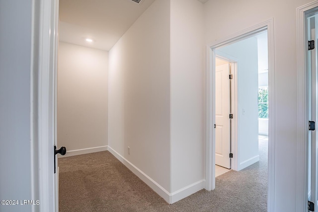 hallway with light carpet