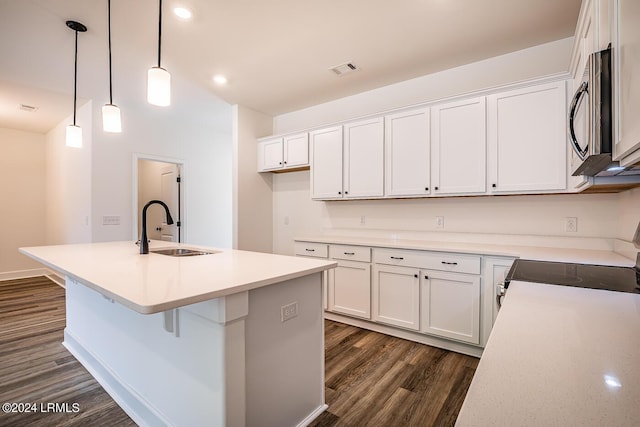 kitchen with white cabinetry, appliances with stainless steel finishes, and sink