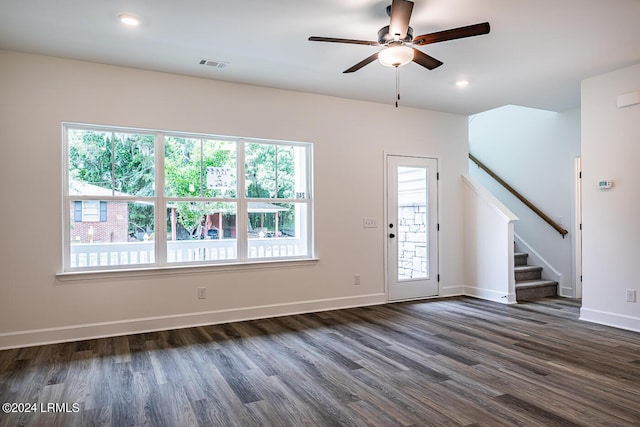 interior space featuring ceiling fan and dark hardwood / wood-style floors