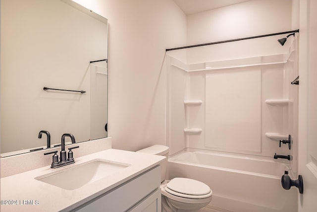 full bathroom with vanity, shower / tub combination, and toilet