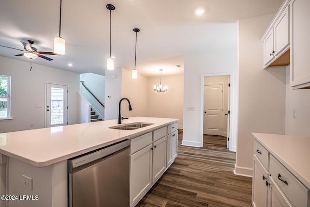 kitchen featuring white cabinetry, stainless steel dishwasher, an island with sink, and sink