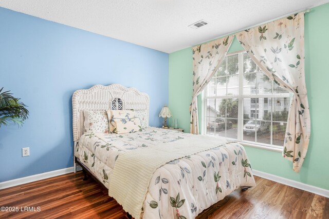 1231 Ladys Island Dr Unit 327, Port Royal, SC 29935 - bedroom with wood finished floors and a textured ceiling