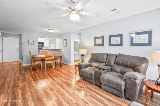 1231 Ladys Island Dr Unit 327, Port Royal, SC 29935 - living room with ceiling fan and light wood-style floors