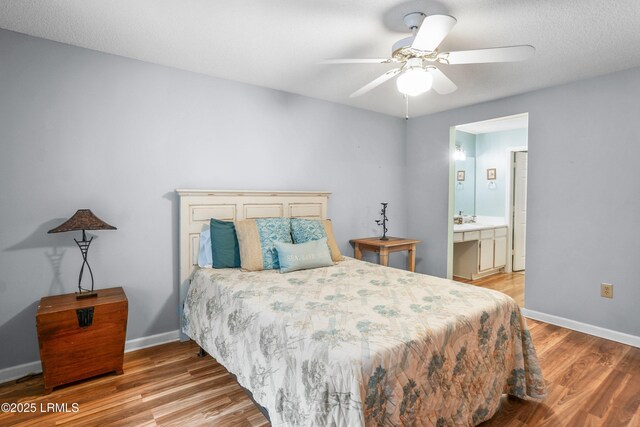 1231 Ladys Island Dr Unit 327, Port Royal, SC 29935 - bedroom with light wood-type flooring, a ceiling fan, and ensuite bathroom