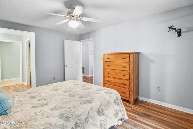 1231 Ladys Island Dr Unit 327, Port Royal, SC 29935 - bedroom with wood finished floors and a ceiling fan