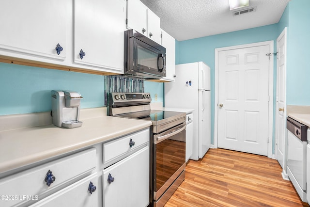 1231 Ladys Island Dr Unit 327, Port Royal, SC 29935 - kitchen featuring stainless steel electric range, black microwave, light wood finished floors, dishwashing machine, and light countertops
