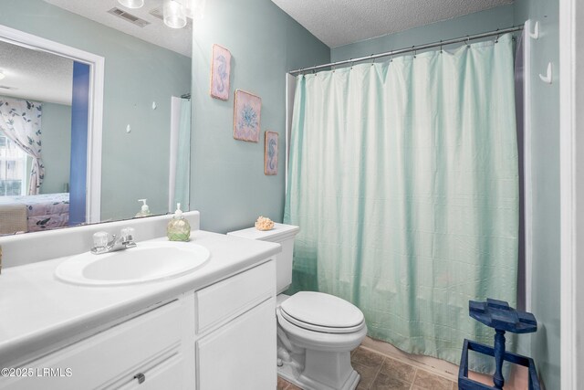 1231 Ladys Island Dr Unit 327, Port Royal, SC 29935 - bathroom with a textured ceiling and vanity