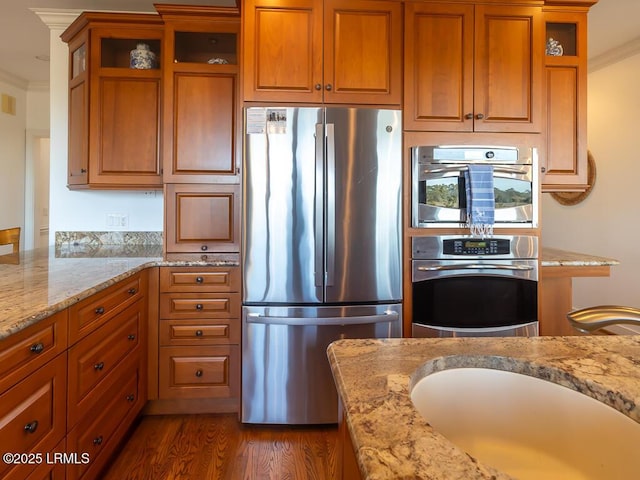 31 Hearthwood Dr, Hilton Head Island, SC 29928 - kitchen featuring a sink, appliances with stainless steel finishes, and brown cabinetry