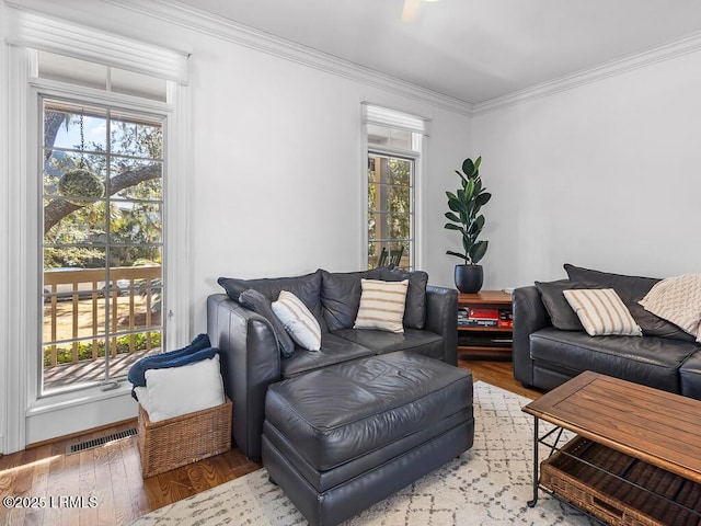 31 Hearthwood Dr, Hilton Head Island, SC 29928 - living room featuring wood finished floors, a wealth of natural light, crown molding, and visible vents