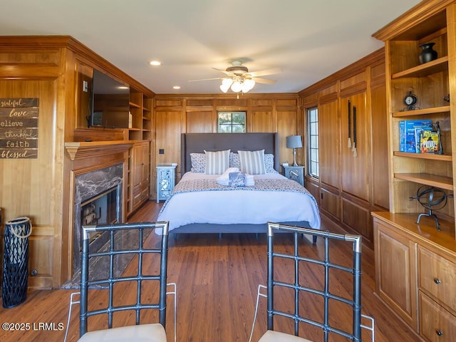 31 Hearthwood Dr, Hilton Head Island, SC 29928 - bedroom with dark wood-type flooring, wooden walls, and recessed lighting
