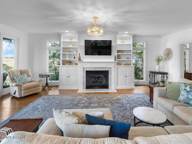 31 Hearthwood Dr, Hilton Head Island, SC 29928 - living area featuring recessed lighting, a high end fireplace, wood finished floors, and ornamental molding