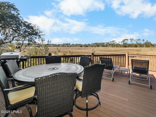 31 Hearthwood Dr, Hilton Head Island, SC 29928 - wooden deck featuring a grill, outdoor dining area, and a rural view