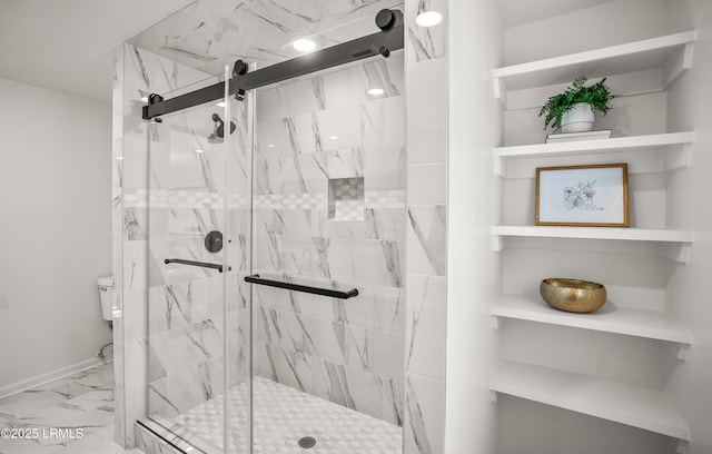 full bath featuring toilet, marble finish floor, and a marble finish shower