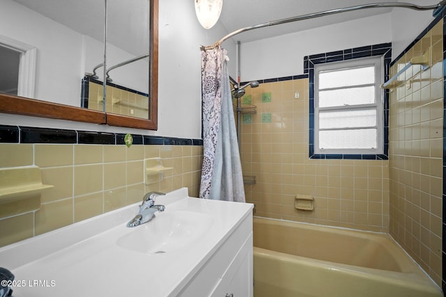21 River Rd, Yemassee, SC 29945 - bathroom featuring shower / tub combo, vanity, tile walls, and wainscoting