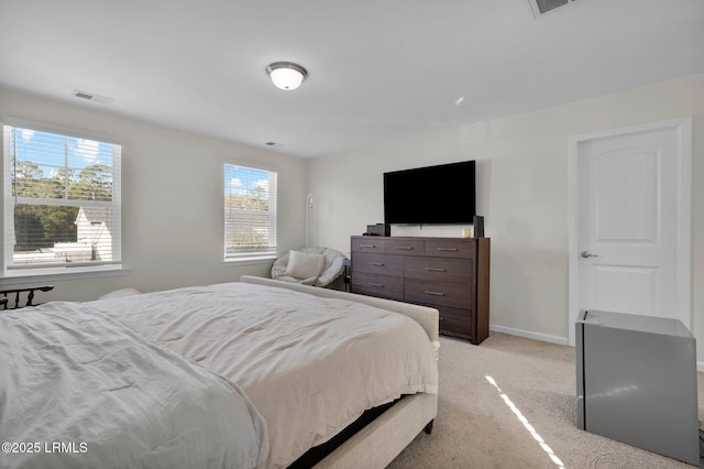 bedroom featuring light colored carpet