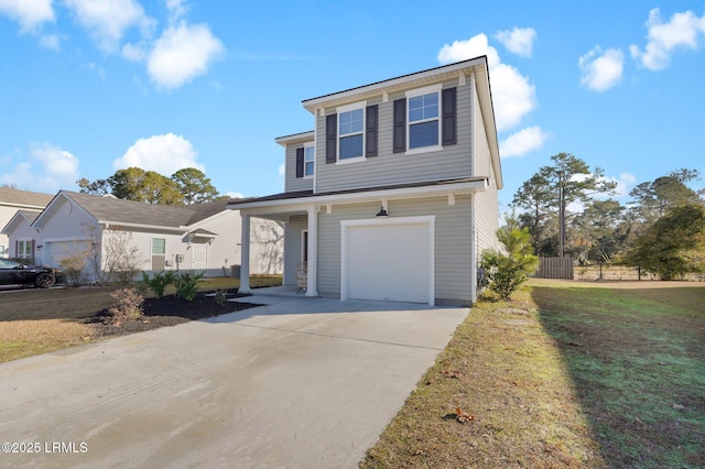 view of property with a garage and a front lawn