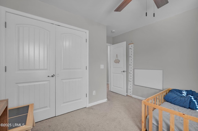 bedroom with light carpet, a closet, and ceiling fan