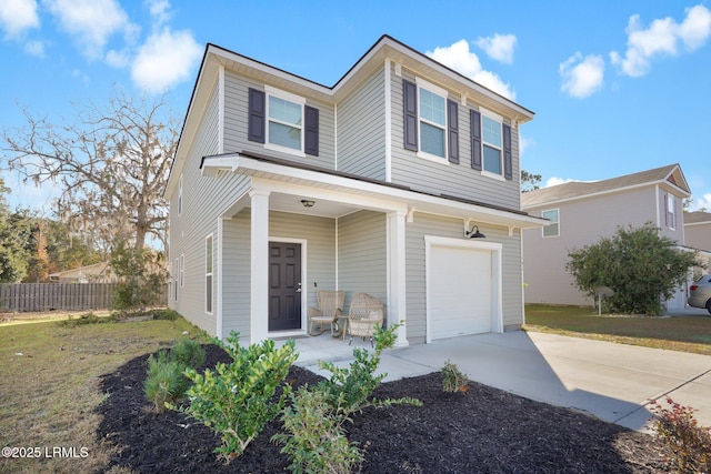 view of property with a porch, a garage, and a front yard