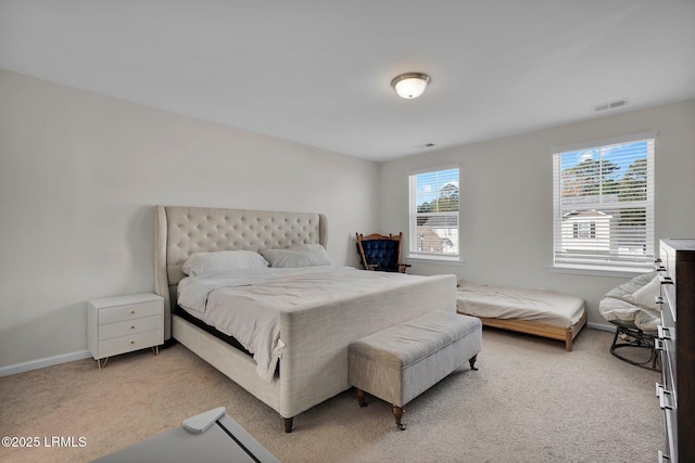 bedroom featuring light carpet